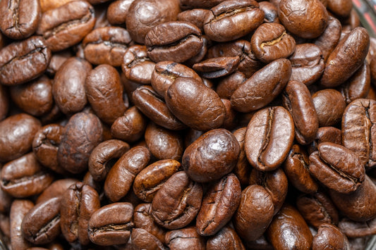 a pile of coffee beans sitting on top of a table