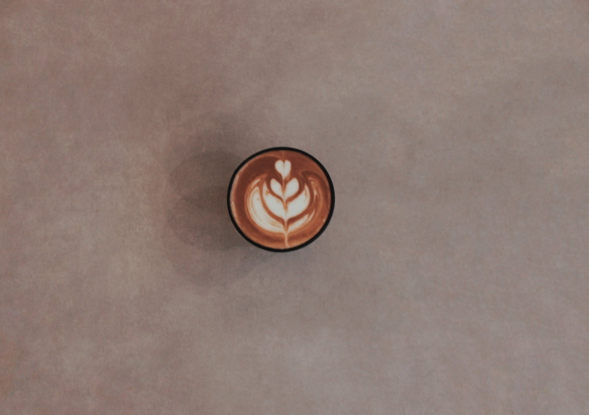brown ceramic mug on gray table