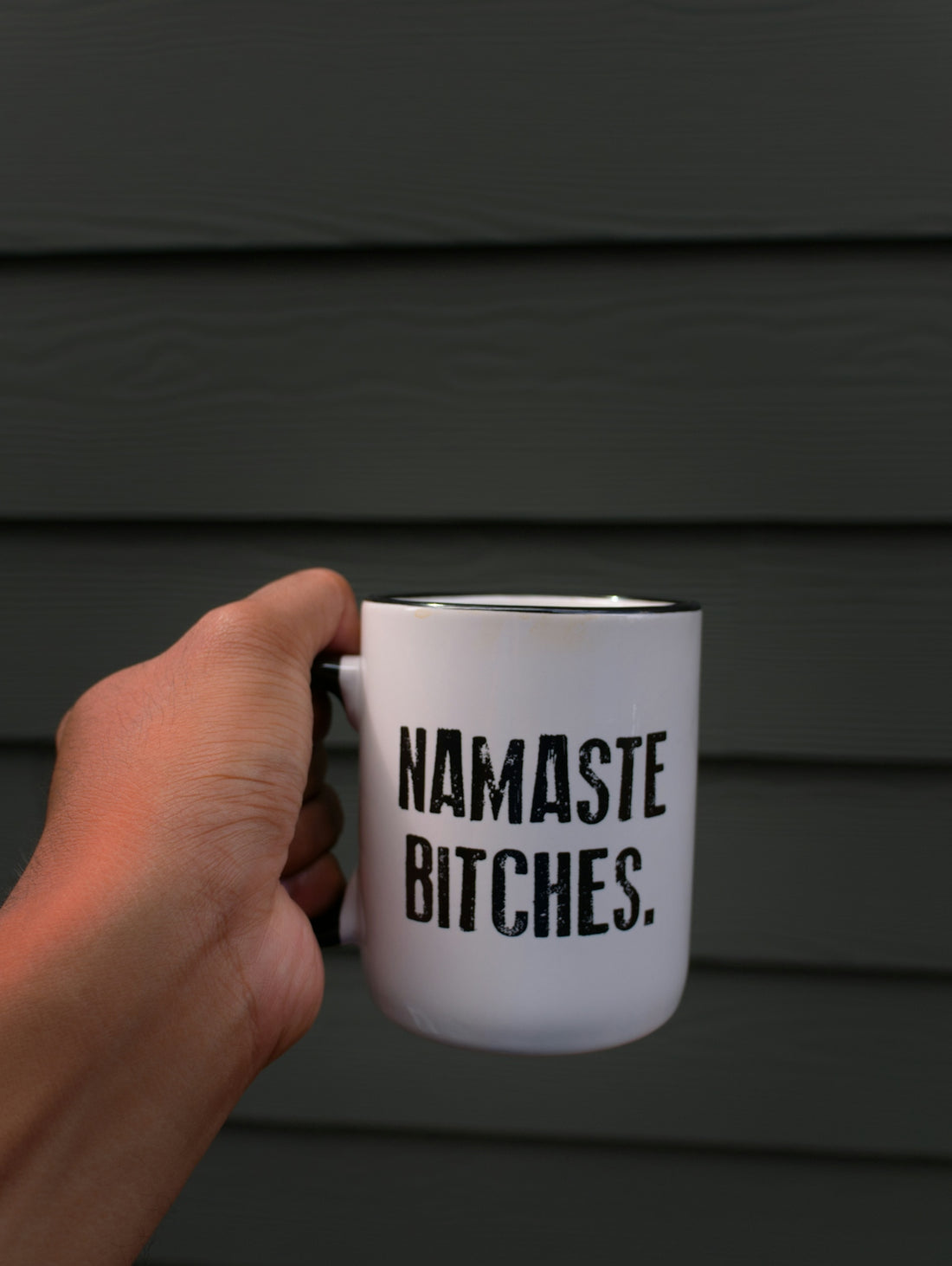 white and black ceramic mug