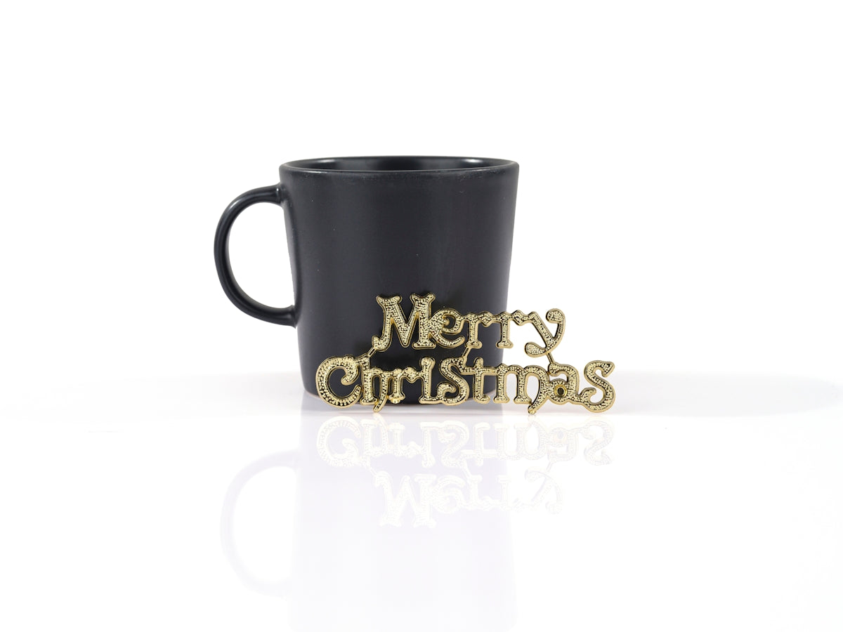 a black mug with gold text
