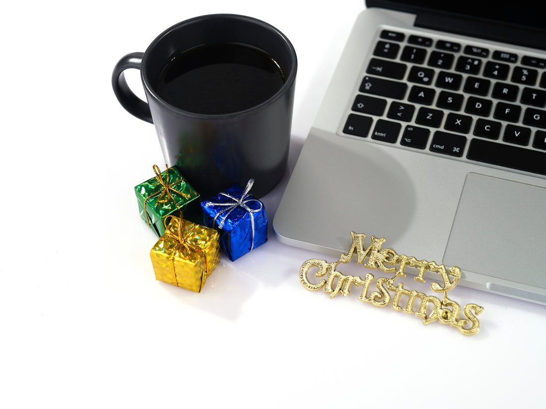 a laptop and a cup of coffee