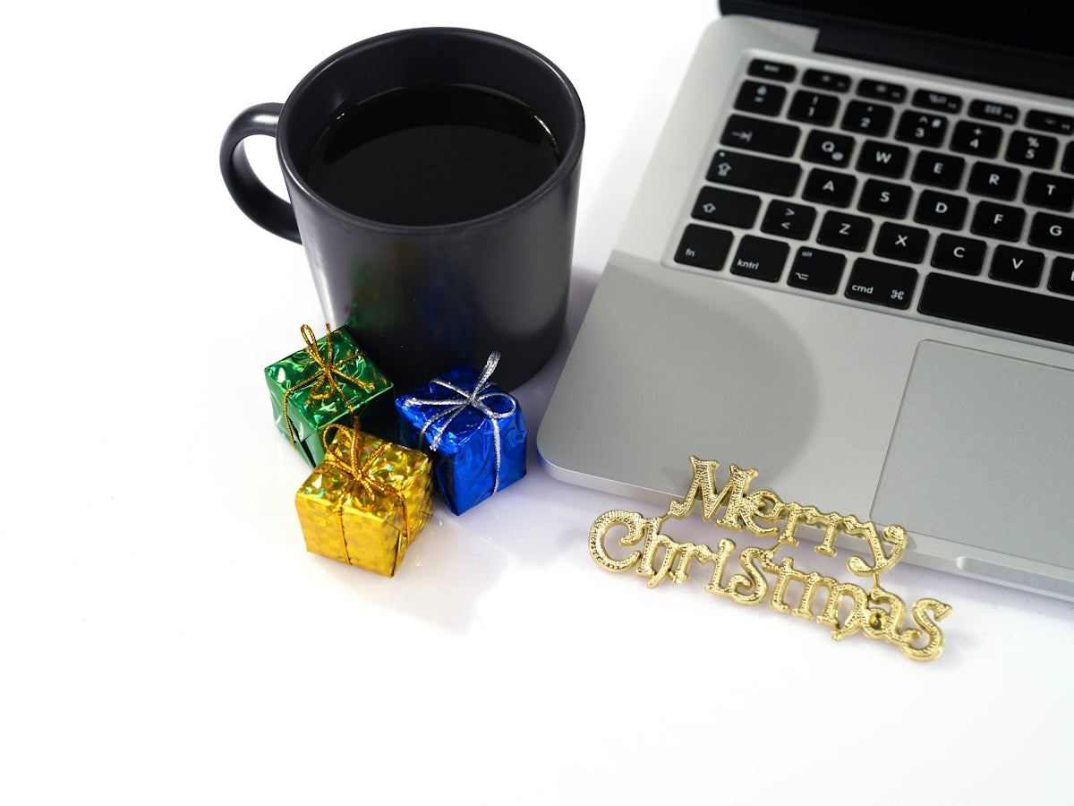 a laptop and a cup of coffee