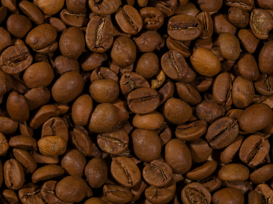a pile of roasted coffee beans