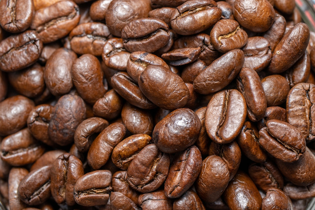 a pile of coffee beans sitting on top of a table