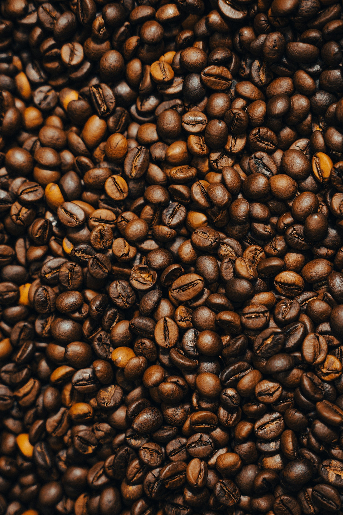 a pile of coffee beans and coffee beans