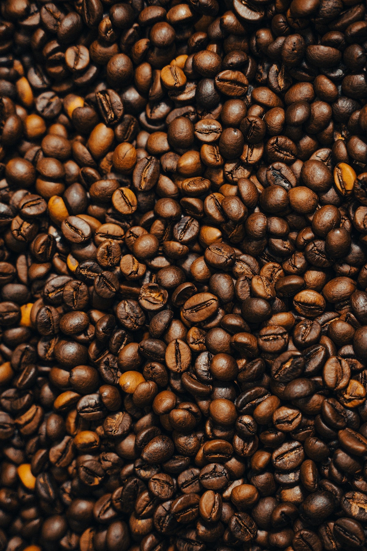 a pile of coffee beans and coffee beans