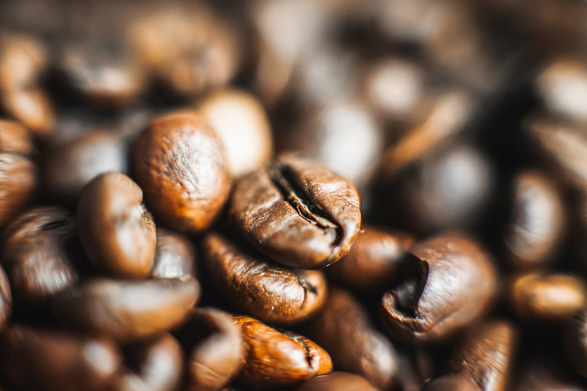 a pile of coffee beans sitting on top of each other