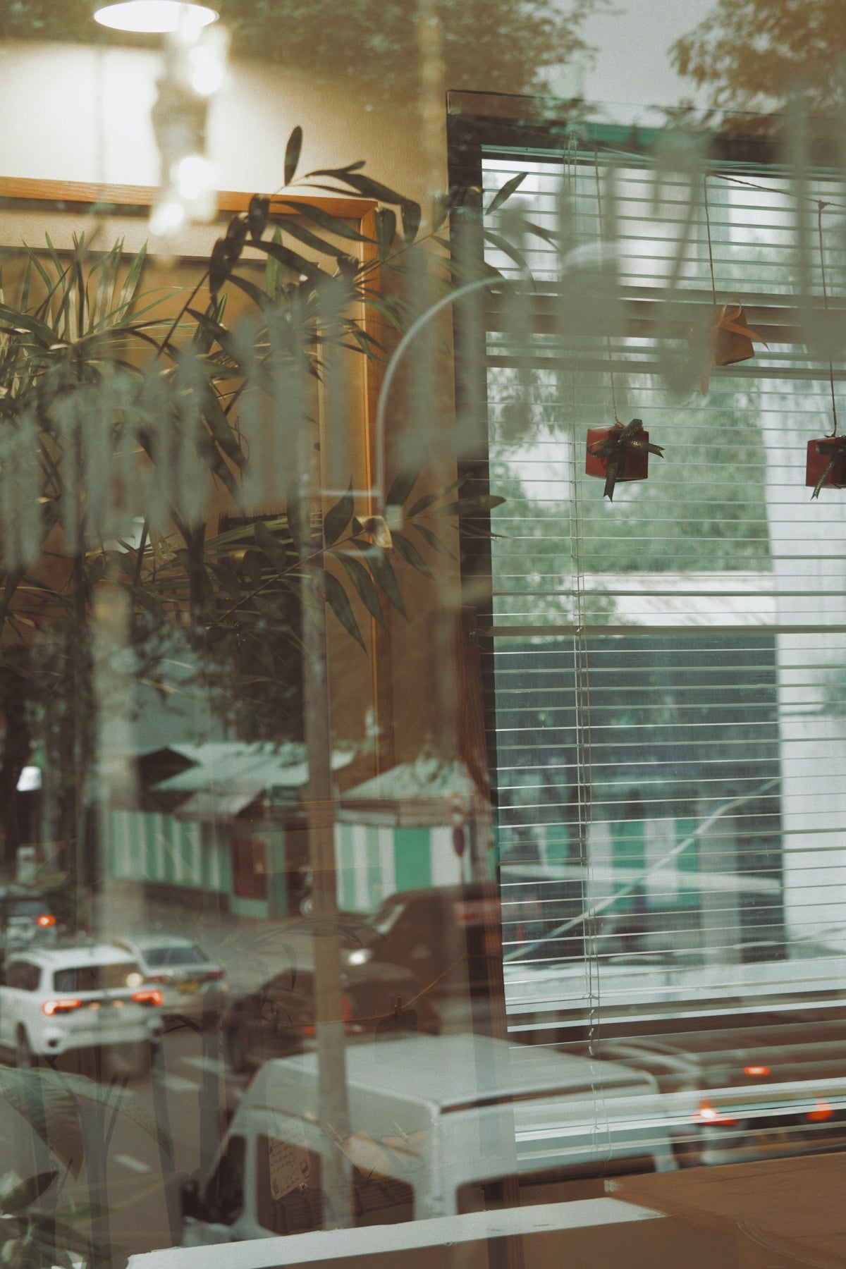 Reflection of street scene with cars and buildings